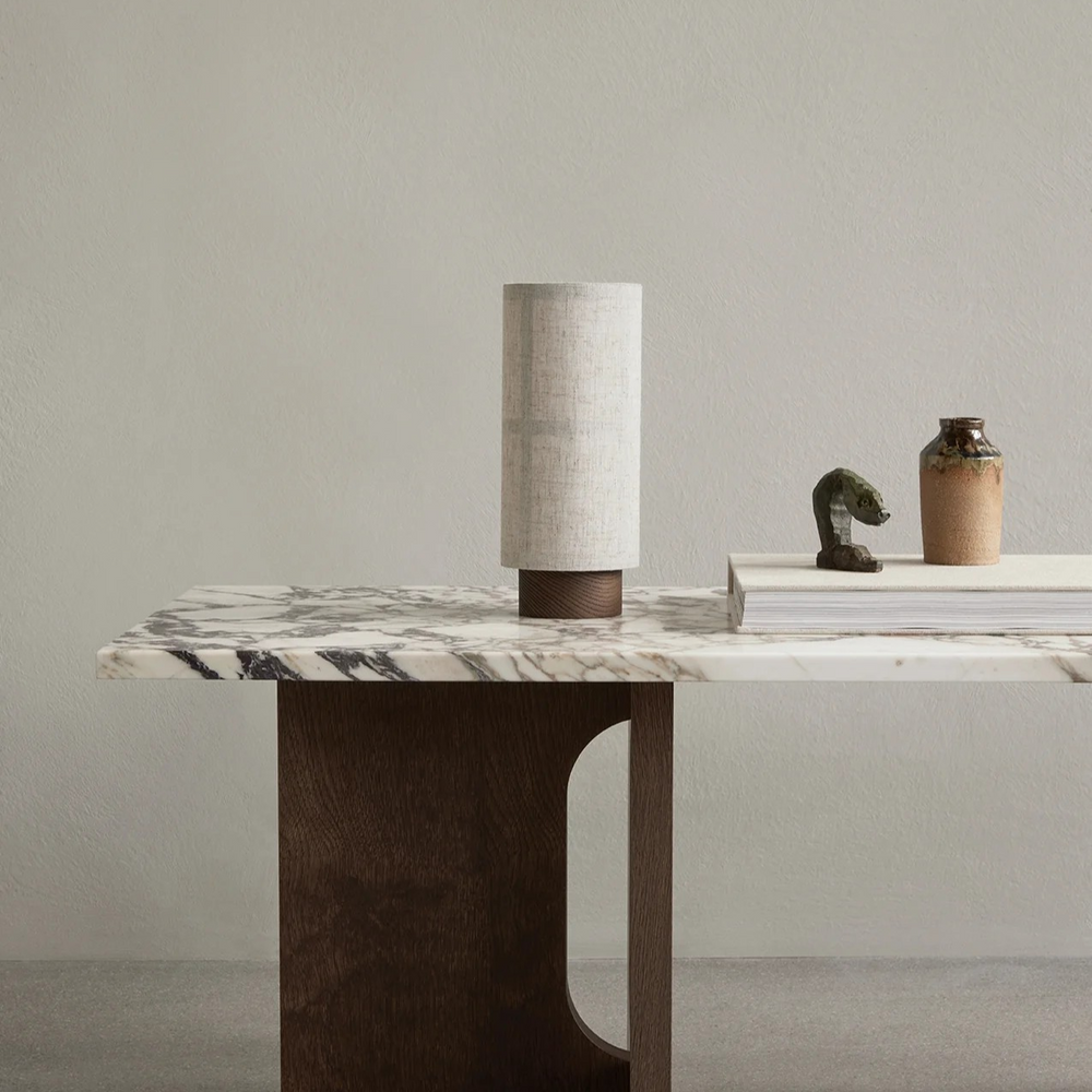 Vensalo Washi cordless table lamp with a walnut base and linen shade on a marble console table