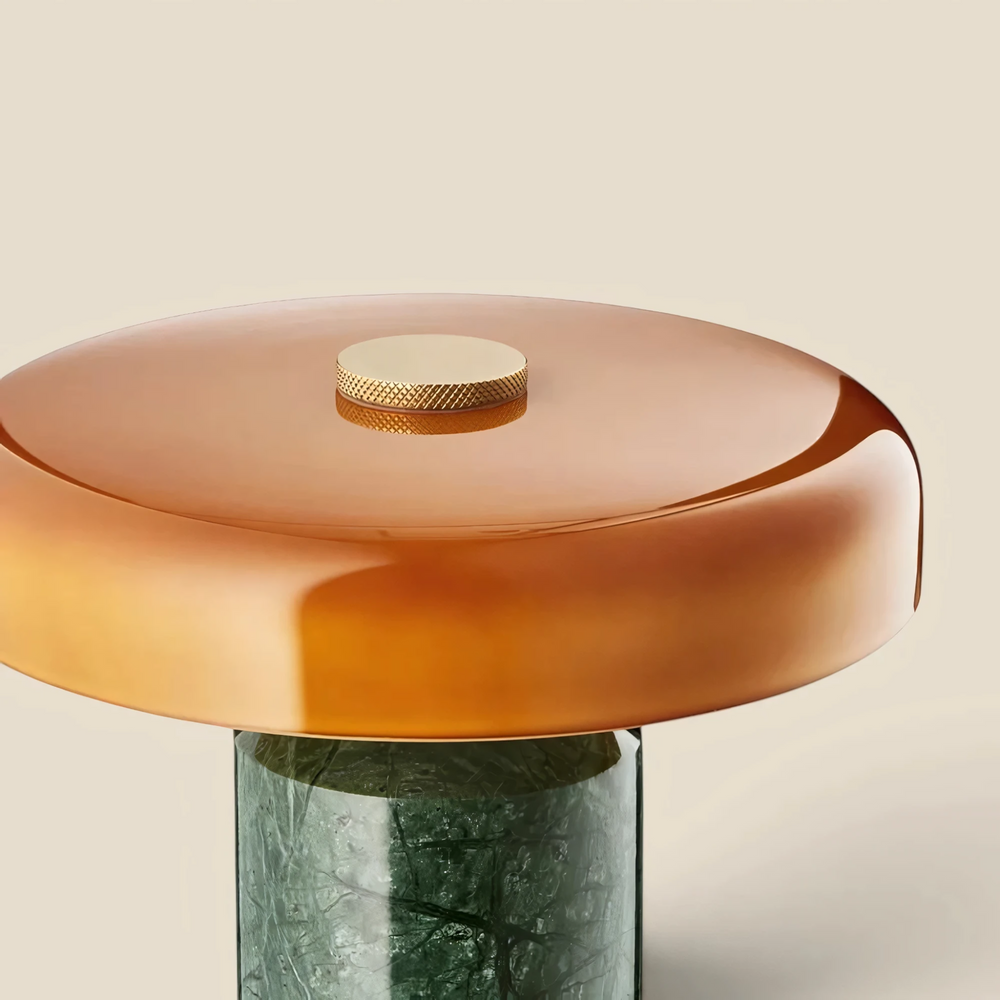 Close-up of the Halo green marble lamp's amber glass shade and knurled brass dimmer dial, HALO-GREEN-01