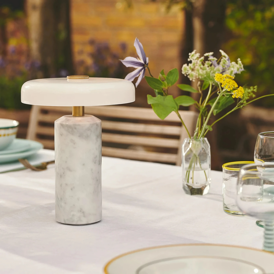 Halo white marble table lamp on a garden dining table with wildflowers and glassware, HALO-WHITE-01