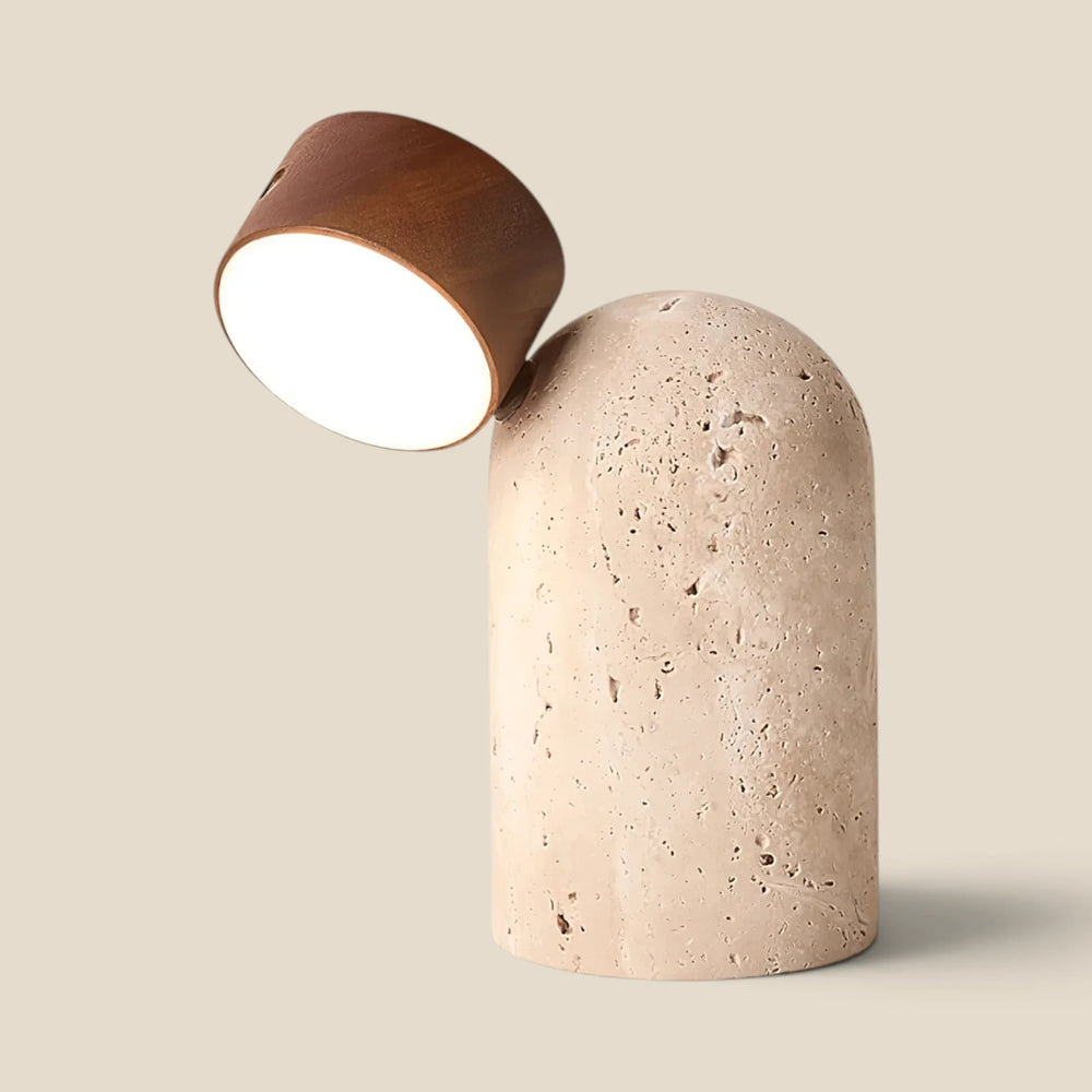 Vensalo Sten portable table lamp, travertine base with the walnut head angled to the left