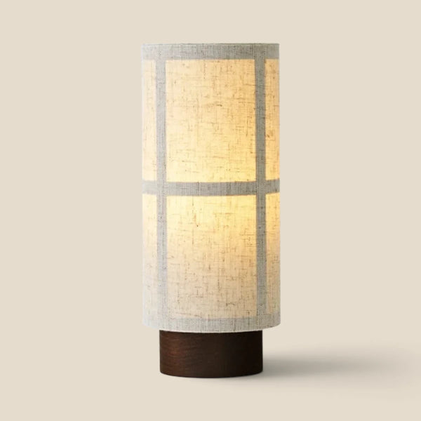 Vensalo Washi rechargeable table lamp, linen shade on a walnut base, lit studio view